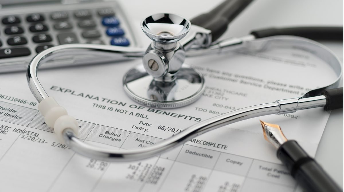 A stethoscope resting on a US health insurance explanation of benefits statement